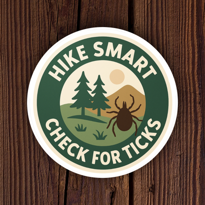 Sticker with 'Hike Smart Check for Ticks' text and tick illustration on a wooden background